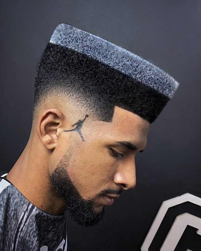 Corte black power com desenho